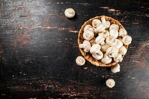 Mushrooms in a basket on the table. photo