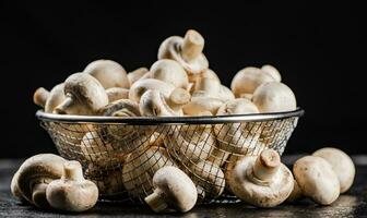 Fresh mushrooms in a colander. photo