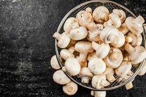 Fresh mushrooms in a colander. photo