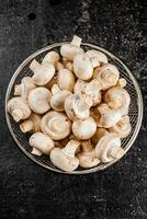 Fresh mushrooms in a colander. photo