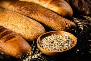 Various bread with grain in a bowl on the table. photo