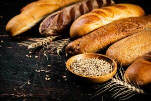 Various bread with grain in a bowl on the table. photo