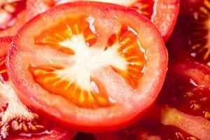 Round pieces of fresh tomato. photo