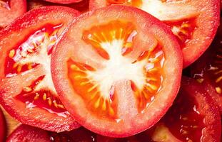 Round pieces of fresh tomato. photo