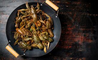 A pot of fresh crayfish. photo