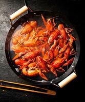 Boiled crayfish in a pot of water. photo