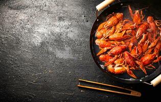 Boiled crayfish in a pot of water. photo