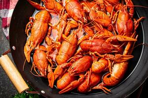 Crayfish are boiled in a saucepan. photo