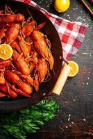 A pot of boiled crayfish on a napkin. photo