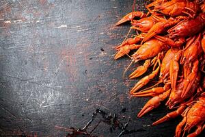 A bunch of boiled crayfish on the table. photo