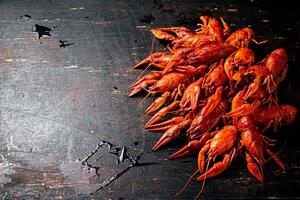 A bunch of boiled crayfish on the table. photo