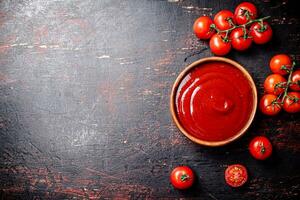 Tomato sauce in a wooden plate. photo