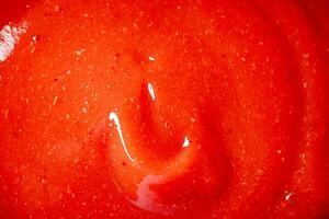 Catsup. Macro background. The texture of tomato sauce. photo