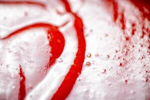 Sauce of ripe tomatoes. Macro background. photo