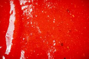 Sauce of ripe tomatoes. Macro background. photo