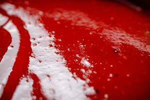 Sauce of ripe tomatoes. Macro background. photo