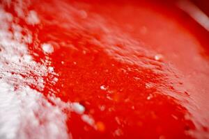 Sauce of ripe tomatoes. Macro background. photo