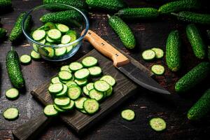 Cucumbers cut on a cutting board. photo