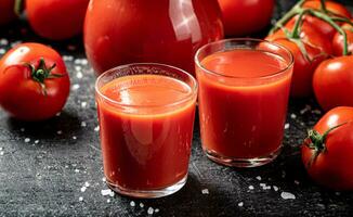 Juice from ripe tomatoes in a glass. photo