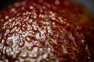 The peel of ripe fresh avocado. Macro background. photo