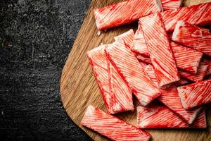 Crab meat on a wooden cutting board. photo