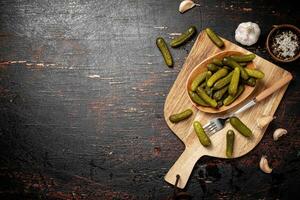 Homemade pickled cucumber on the table. photo