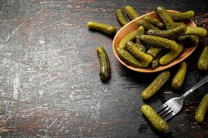 Homemade pickled cucumber on the table. photo