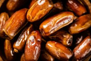 Delicious sweet dates. Macro background. photo