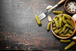 Homemade pickled cucumber on the table. photo