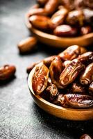Two plates of dates on the table. photo