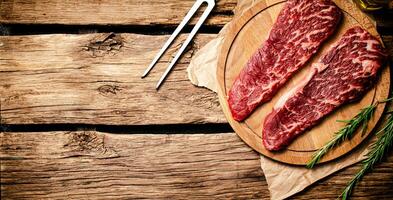 Raw steak on a cutting board. photo