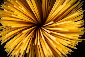 A bunch of dry pasta on the table. photo