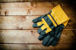 A pair of construction gloves on the table. photo