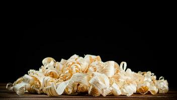 A bunch of wood chips on the table. photo