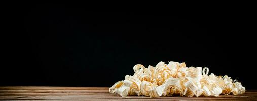 A bunch of wood chips on the table. photo