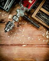 Hand drill with various drills. photo