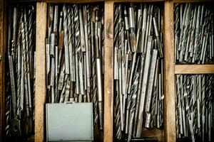 Various drill bits for drills. photo