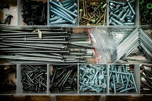 Various nails and bolts for fastening. photo