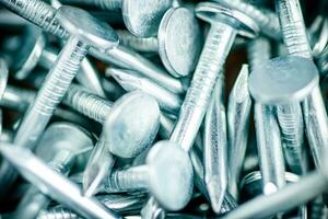 A pile of roofing nails. Macro background. photo