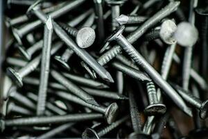 A pile of bolts. Macro background. photo