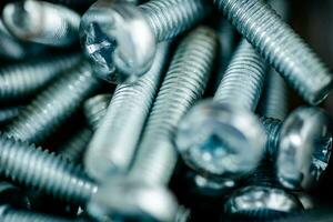 A pile of bolts. Macro background. photo