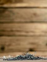 A pile of nails on the table. photo