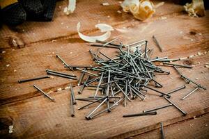 Construction nails on the table. photo