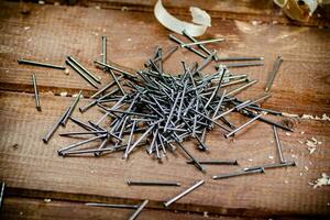 A pile of nails on the table. photo