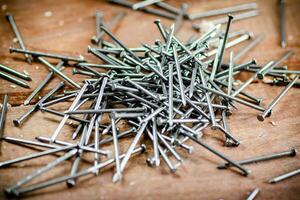 A pile of nails on the table. photo