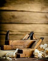 Working tool. Planer with wooden shavings. photo