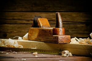 Working tool. Planer with wooden shavings. photo