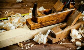 Working tool. Planer with wooden shavings. photo