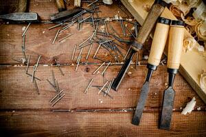 Working tool. Chisel, hammer and nails. photo