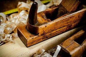 Working tool. Planer with wooden shavings. photo